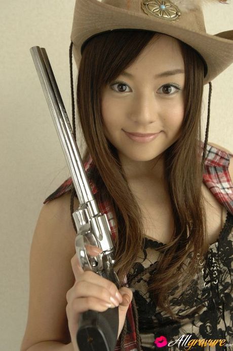 Adorable asian cowgirl tempts in her boots and jean shorts